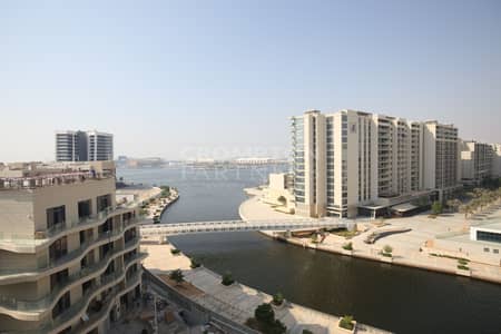 2 Bedroom Apartment for Rent in Al Raha Beach, Abu Dhabi - Closed Kitchen | Canal View | Available Now