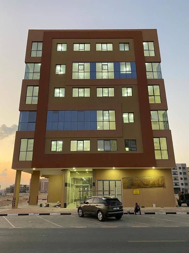 For sale a new building in Al Raqaib area \ Ajman  Great location, main Street