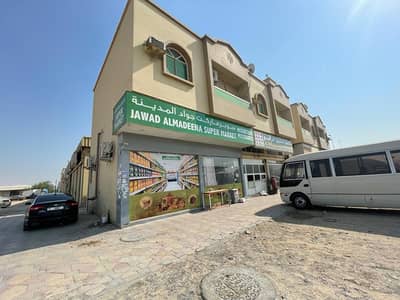 Warehouse for Sale in Al Jurf, Ajman - For sale an industrial building in Ajman, Al Jurf Industrial Area 3, freehold, with an income of one million 250 thousand
