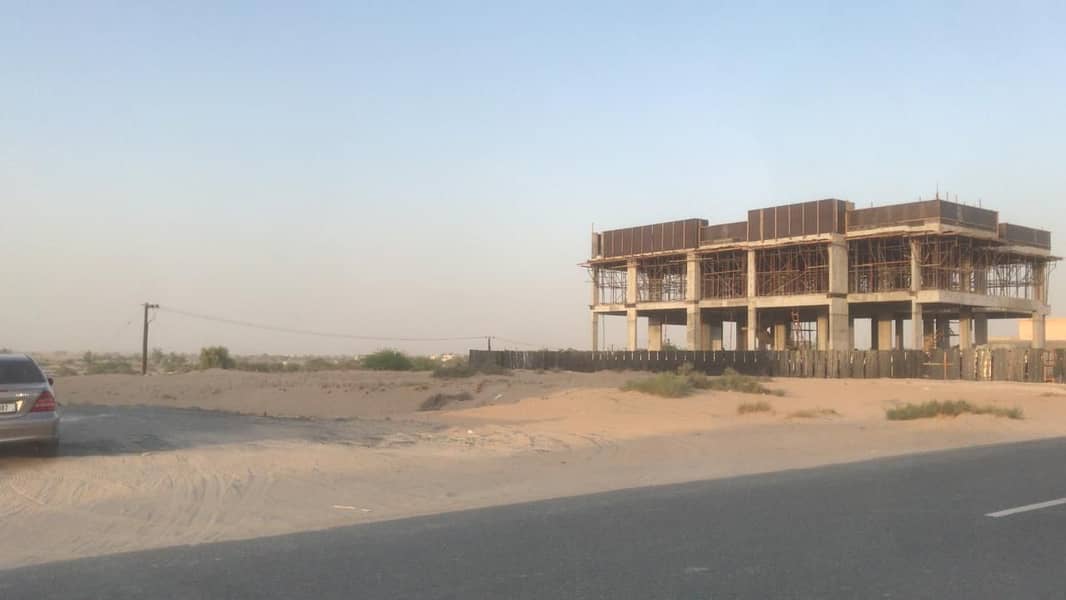 Two plots of land for sale attached to 40,000 feet in Al Hoshi area, very excellent location on Qar Street, freehold.