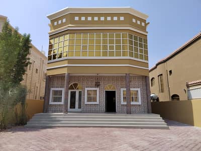 Villa for rent in Al Rawda 1, consisting of 5 rooms, a hall and a board wit