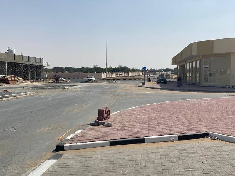 Commercial land for sale in Al Zahia
