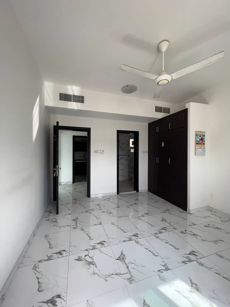 For rent in Ajman a room and a hall in the Rashidiya area, a master room with a balcony