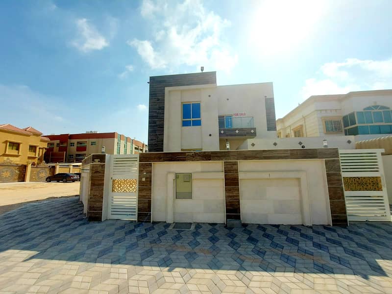 Villa for sale, corner of two streets, of the most luxurious villas in Ajman, with European design and super deluxe finishing, with the possibility of