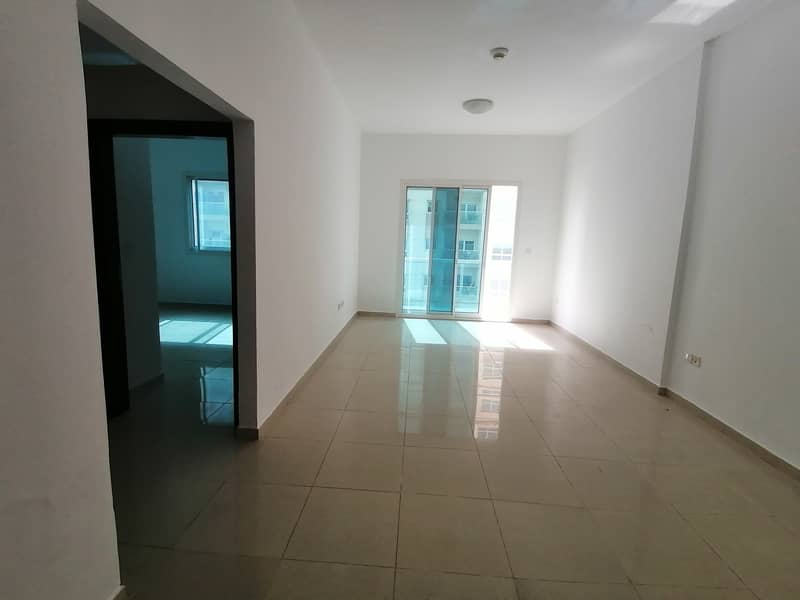 chiller free luxery 1-bhk with 2-bath balcony gym pool coverd parking front of RTA stop just in 36k.