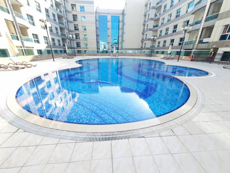 Chiller free 1bhk with 12 payments with covered parking wardrobes Gym and pool rent only 51k