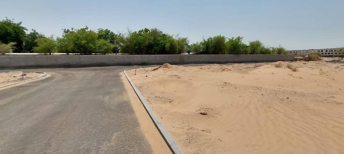 For sale two adjacent lands in Ajman, Al Zahia neighborhood, the corner of two streets, residential and investment, an area of ​​307 meters, each at a