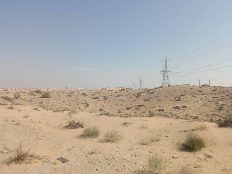 For sale a large commercial land on the street corner in the Al Hoshi area in Sharjah