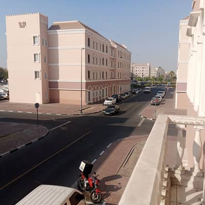 استوديو  للايجار في المدينة العالمية، دبي - Balcony view