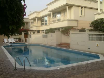 4 Bedroom Villa Compound for Rent in Al Safa, Dubai - Compound 4bhk villa with p . garden s. pool in safa 2 rent is 300k