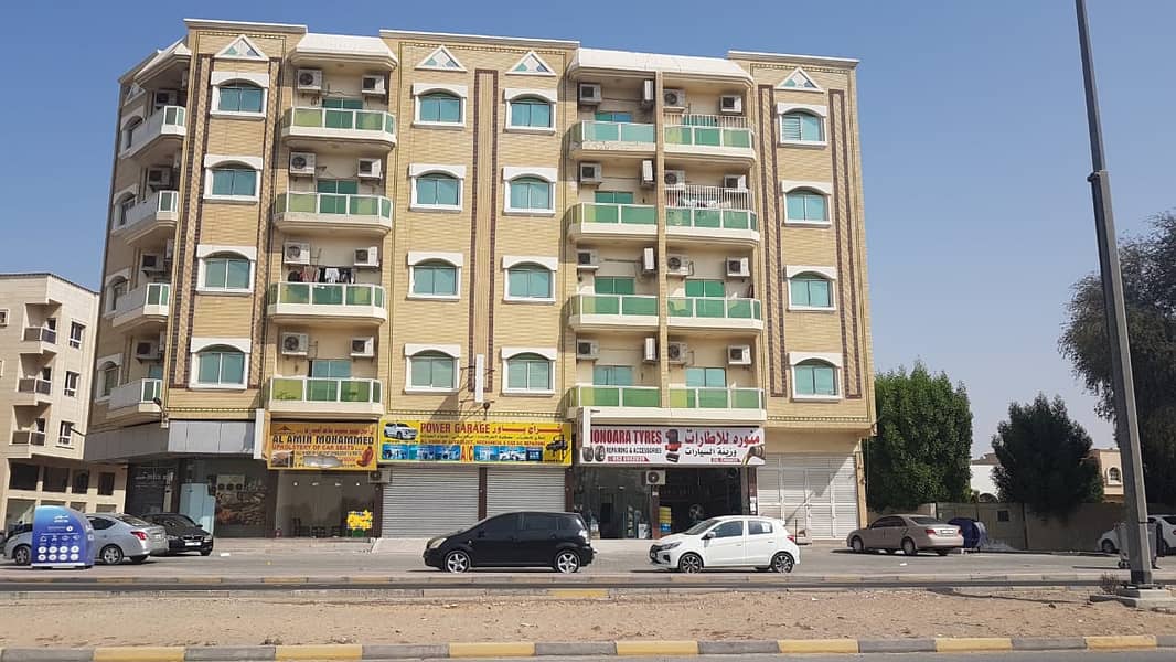 for sell FREE HOLD   nice building G+4  main Road  to Dubai  5 years old Corner  location