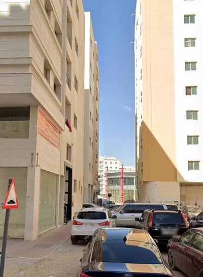 Plot for Sale in Al Hamidiyah, Ajman - Commercial land for sale in Al-Hamidiya, a distinguished location, next to the buildings