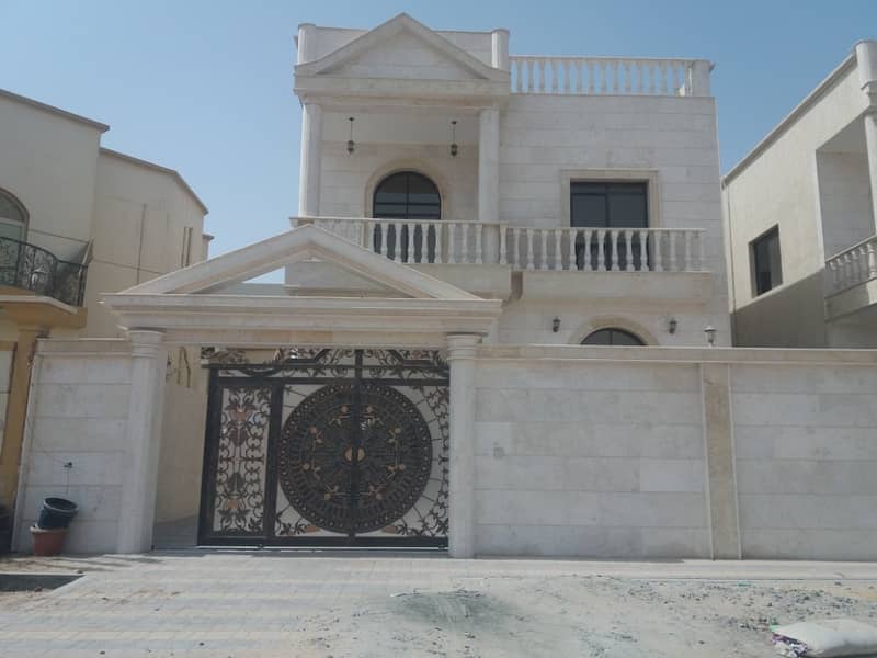 Villa in Ajman for sale free ownership faced stone with decorations