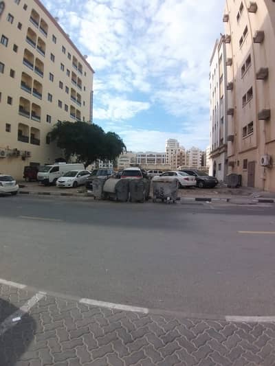 Plot for Sale in Bu Tina, Sharjah - For sale residential and  commercial land in Sharjah / Al Butinah  On two main streets