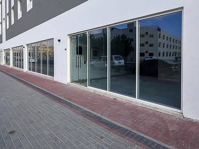 Shop for Rent in Muhaisnah, Dubai - Shell & Core | Main Road Access | Attached Kitchen