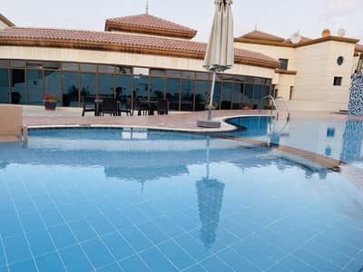 Luxurious 2 Bedroom Hall Apartment for rent in Khalifa Park with Shaded Parking, Pool,Gym &Kids Play