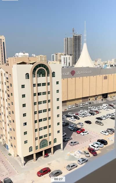 2 Bedroom Apartment for Sale in Bu Daniq, Sharjah - Apartment for sale in Afamia Tower 2, Al Qassimia / Sharjah, directly opposite Mega Mall