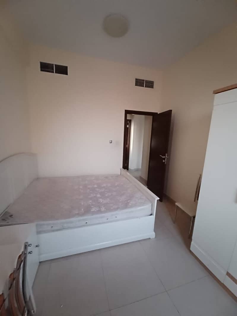 Room and hall, central air conditioning, second inhabitant, opposite Ajman Court, behind Etisalat