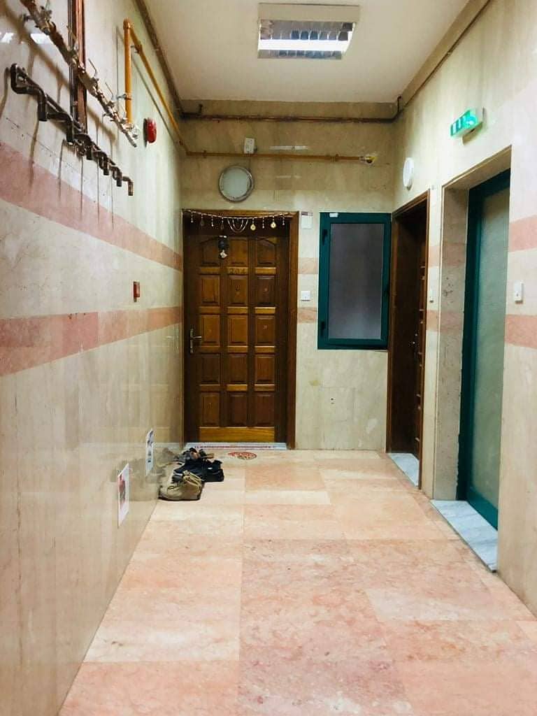 Apartment in Al Nabaa in Sharjah, a room, a hall and a bathroom, excellent location, security and guards, 24 hours maintenance, the owner has to pay f