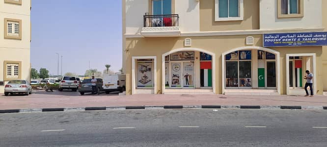 Shop for Sale in International City, Dubai - | Corner Front Side | Shop For Sale | in Greece cluster |