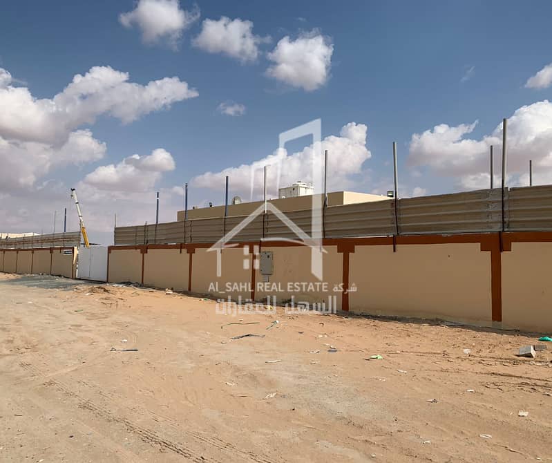 Walled land (Houta) in a prime location in Al Saja'a