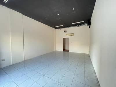 Shop for Rent in International City, Dubai - ROUND ABOUT FACING CORNER SHOP AVAILABLE IN GREECE CLUSTER VERY CHEEP PRICE