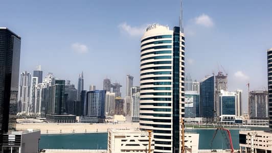 Studio for Rent in Business Bay, Dubai - Studio |  with Kitchen Appliances | partial Burj khalifa view |Business Bay