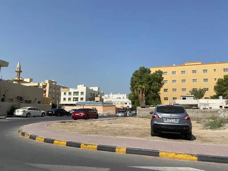 Commercial Land In a Corner Street for sale On two Streets  -- Excellent Location -- in Alnuaimiya Ajman