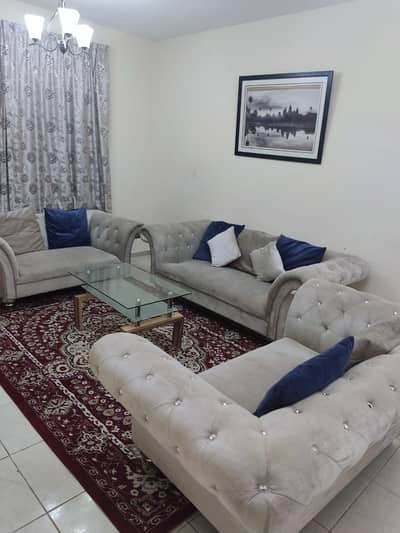 1 Bedroom Apartment for Rent in Al Taawun, Sharjah - Furnished room and hall with clean brushes, with a balcony with a view