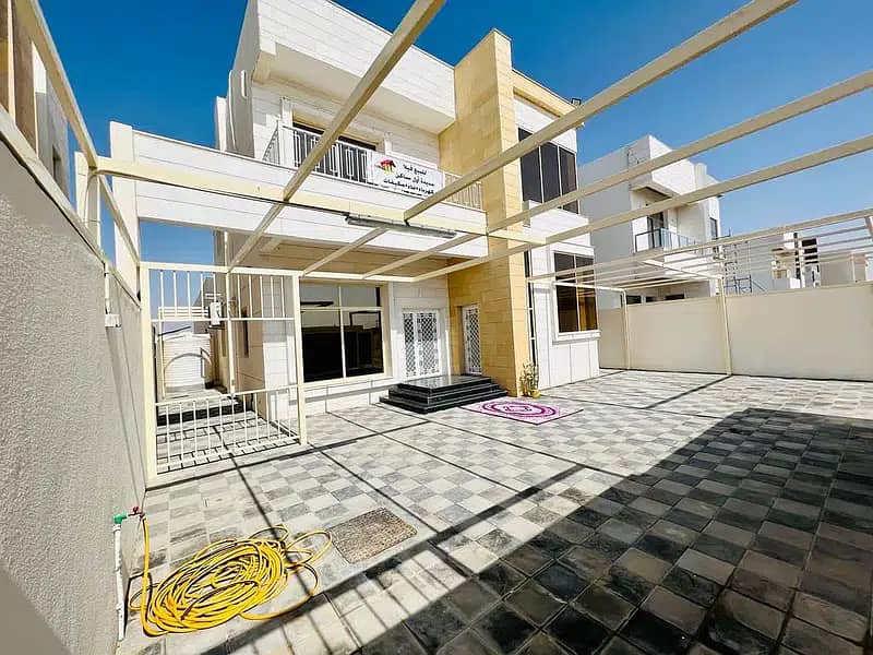 Villa for sale in Ajman, two floors, 4 master rooms, without down payment and without annual fees, only a monthly installment of 5000 dirhams