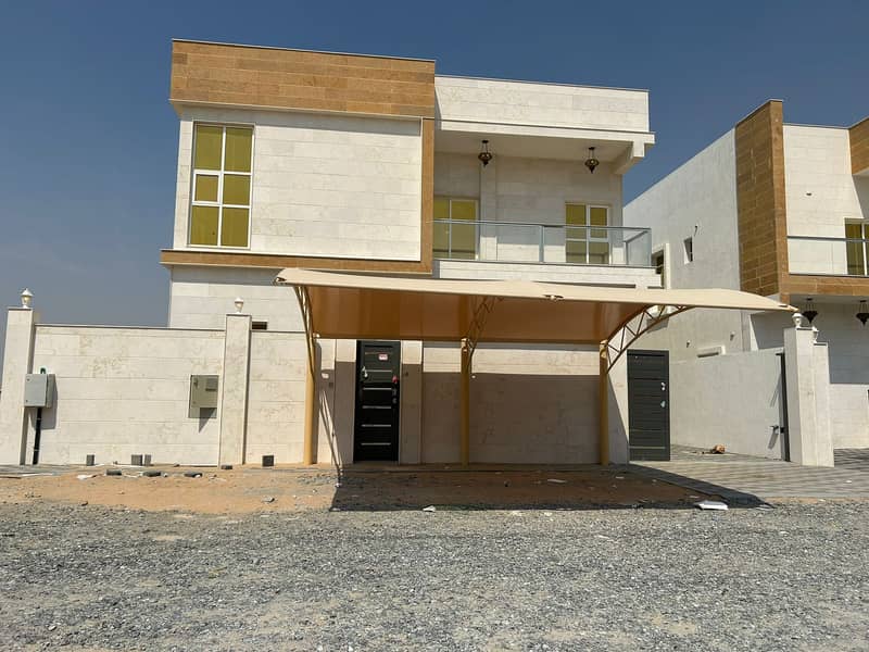 For rent, a villa for the first inhabitant in Ajman, European finishing, modern design, large areas on the asphalt street, the villa directly opposite