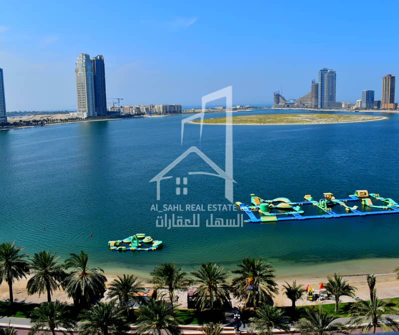 A two-bedroom apartment with a charming front view of Al Khan Lake