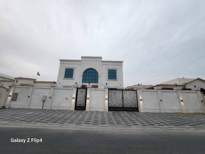 Villa for sale in Ajman Al Raqayeb, central air conditioning, completely stone facade