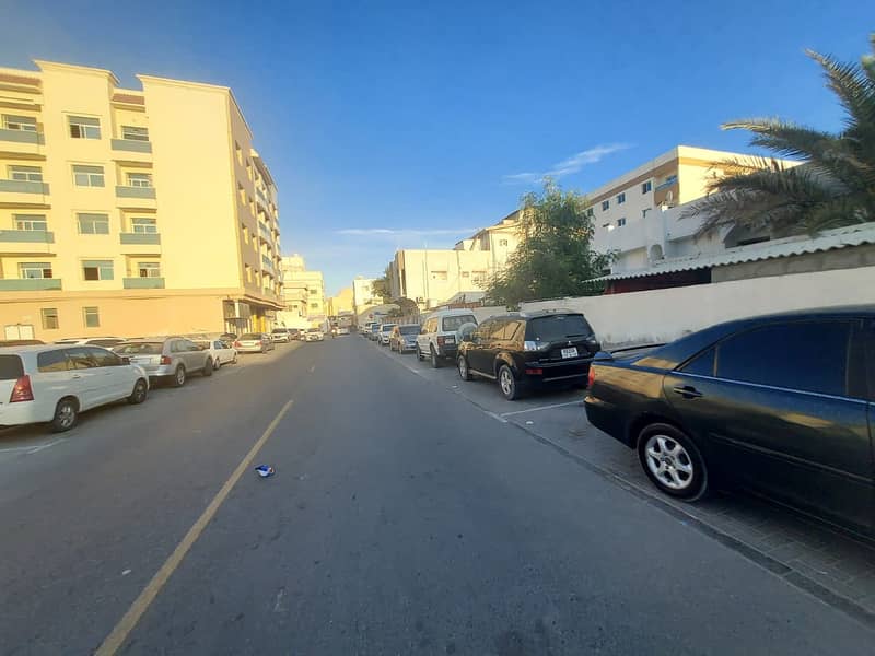 10,000 feet, corner of two streets, owns residential and commercial land in a very special location in Ajman, Al Nuaimiya 1, Kuwait Street - an opport