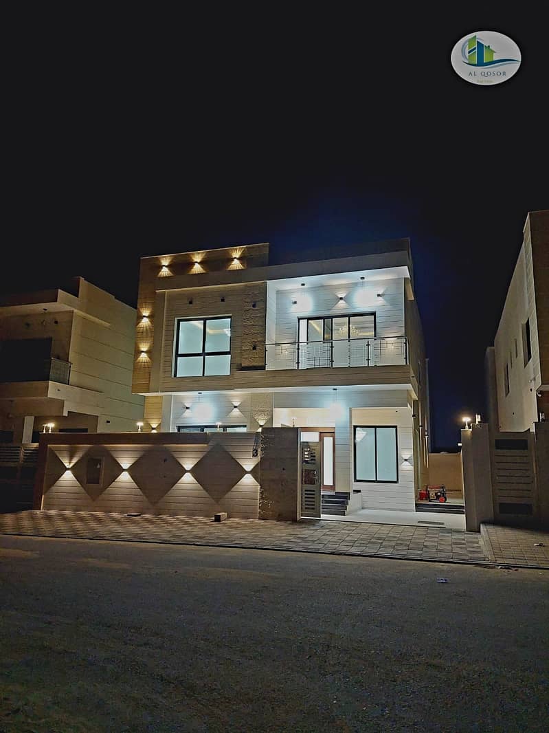 Directly next to a garden, a villa for sale in Ajman, the Jasmine area, two floors, a stone face,