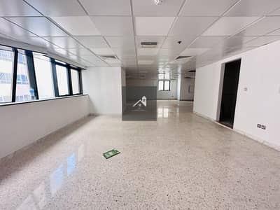 1 Bedroom Flat for Rent in Tourist Club Area (TCA), Abu Dhabi - Spacious very Big Office with one month Free 65k price , 109 sqmt Size located in Tca