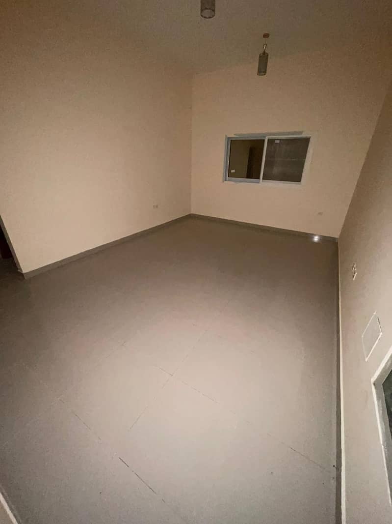 Monthly apartment in Ajman, one room, hall, kitchen and 1 bathroom, spacious areas, central air conditioning, including bills, close to all services