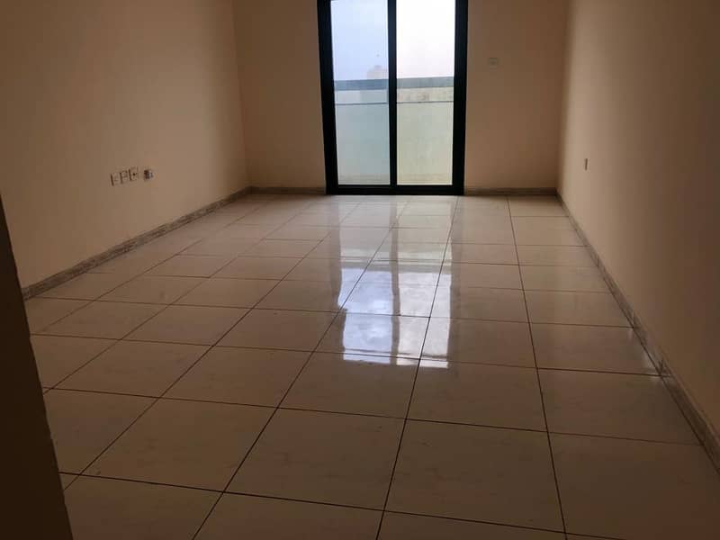 Annual apartment in Ajman, room, hall, kitchen, 1 bathroom, balcony, spacious areas, central air conditioning, with two months free, family tower only