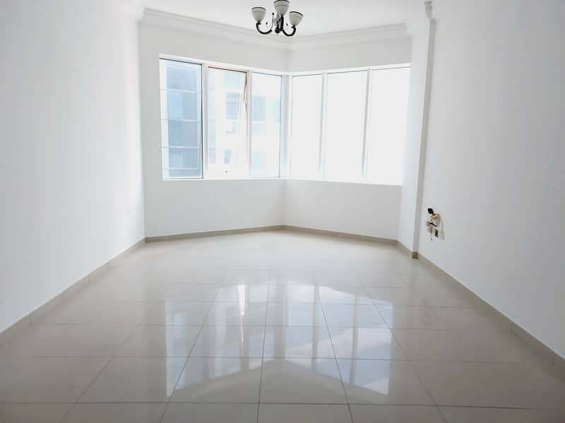 900 sq-ft 1bhk with open kitchen, wardrobes, gym, s/pool in al Taawun area rent 25k in 4/6 cheqs