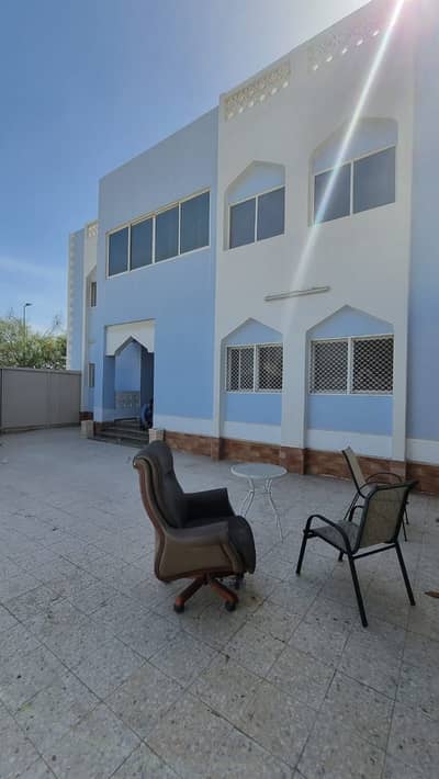 For rent, the ground floor of a two-story villa in Al Jurf 1, on an asphalt street