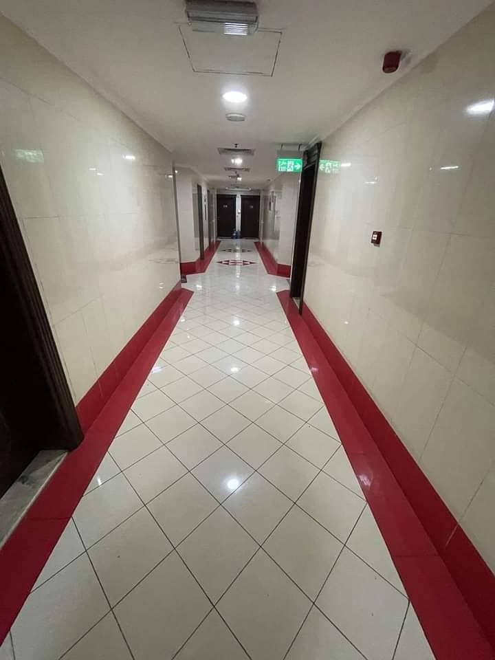 Annual apartment in Ajman, room, hall and kitchen, spacious areas, central air conditioning, with free parking, very clean tower, families only