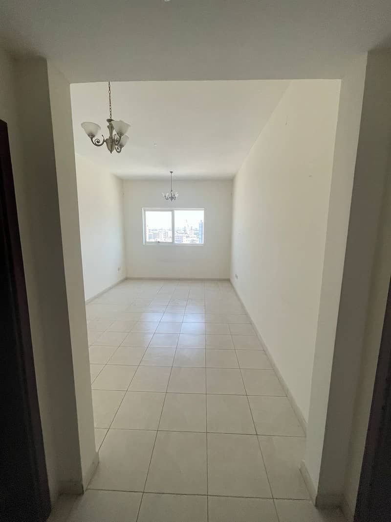 A monthly apartment in Ajman, a room, a hall and a kitchen, very spacious areas, central air conditioning, a master room, including bills, close to al