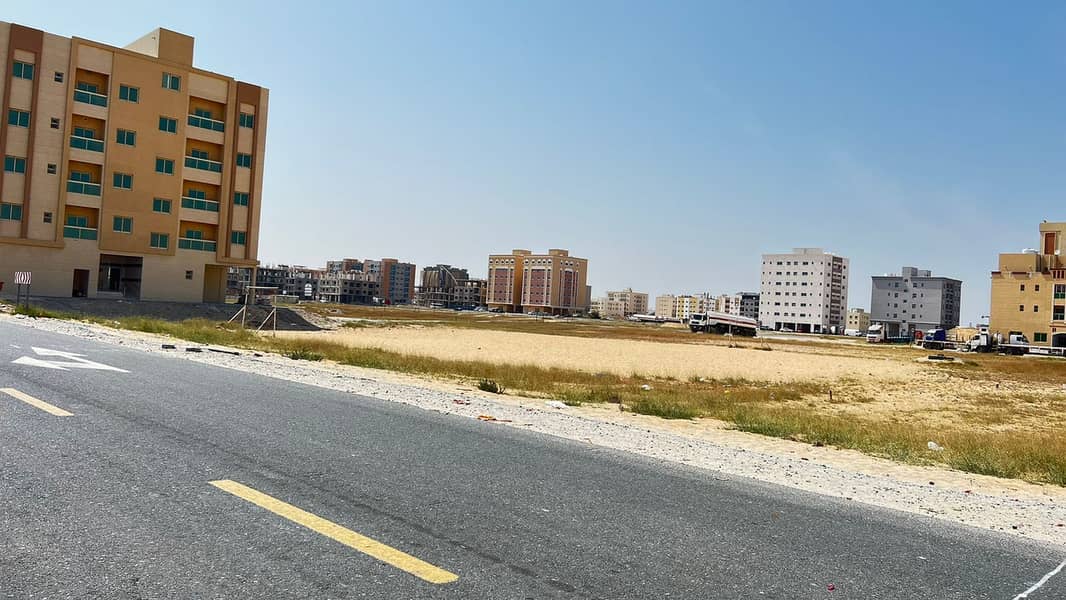 For sale land in Ajman Al Jurf, an area of 900 meters, residential, commercial, ground license, and 8 floors, at a snapshot price