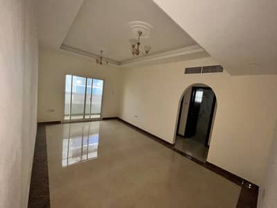 For rent in Ajman, an apartment, a room and a hall, with a balcony, with 2 bathrooms, a very large area, the first inhabitant of Al-Rawdah, Baghdad St