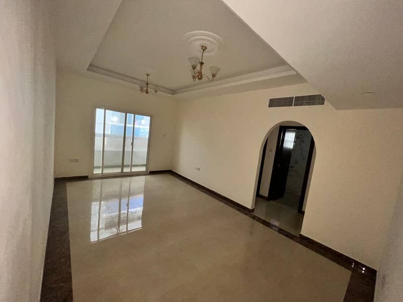 For rent in Ajman, an apartment, a room and a hall, with a balcony, with 2 bathrooms, a very large area, the first inhabitant in Al-Rawdah, close to S