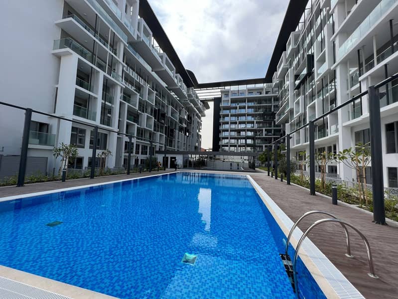 High-Quality Studio Fully Furnished  12 cheque  Balcony + Nice kitchen +GYM ,+ Pool.