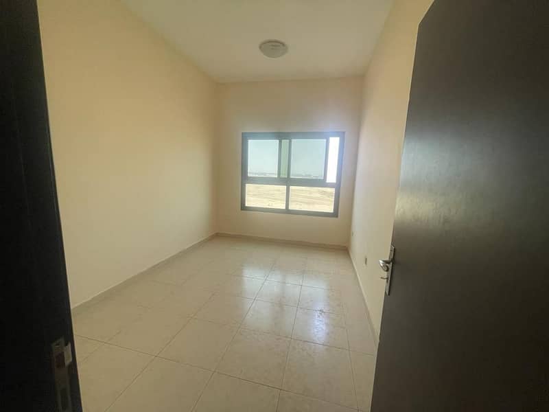Spacious two bedroom Hall apartment with covered car parking available for rent in Paradise Lake Towers  B9  Emirates City Ajman