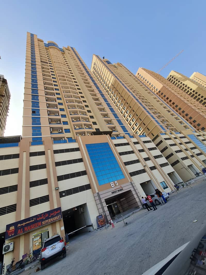 BEAUTIFUL VACANT TWO BEDROOM HALL WITH PARKING IN PARADIES LAKE TOWER AJMAN