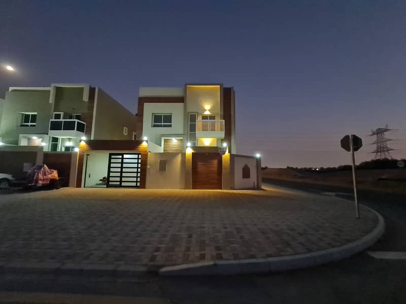 For sale villa Jasmine Ajman opposite the garden, consisting of five bedrooms, a sitting room, a hall, a large kitchen,