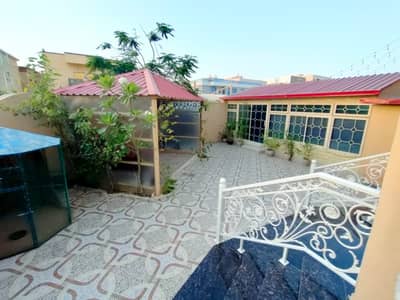 6 Bedroom Villa for Sale in Al Mowaihat, Ajman - Villa for sale in Ajman, Al Mowaihat area, corner of two streets, with electricity and water, two floors, modern design, personal finishing, for sale,